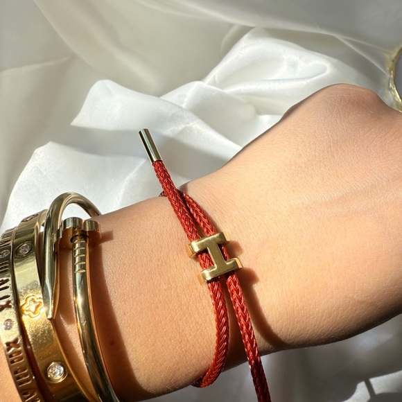 Adjustable wire bracket 
Red and Gold Braided Bracelet - Picture 10 of 10